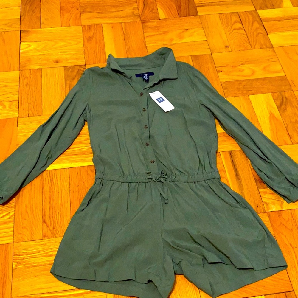 Green romper. never worn still has tags.